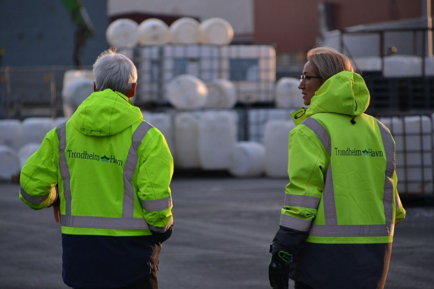 Warehouse workers and forklifts sharing a busy site