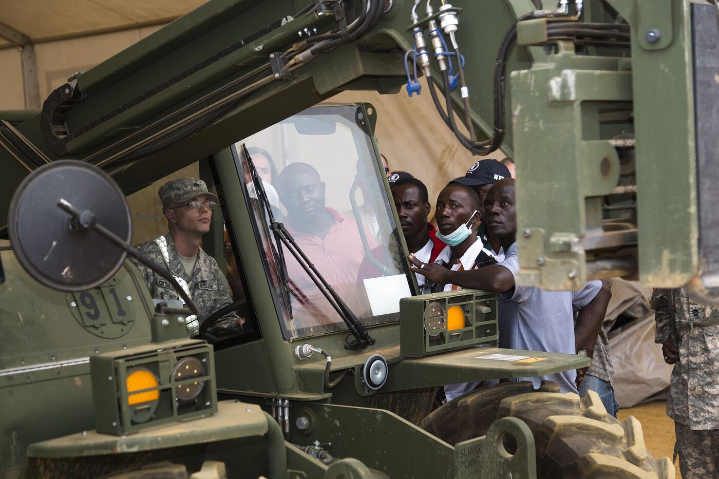 An instructor talking an operator through a forklift manoeuvre during training