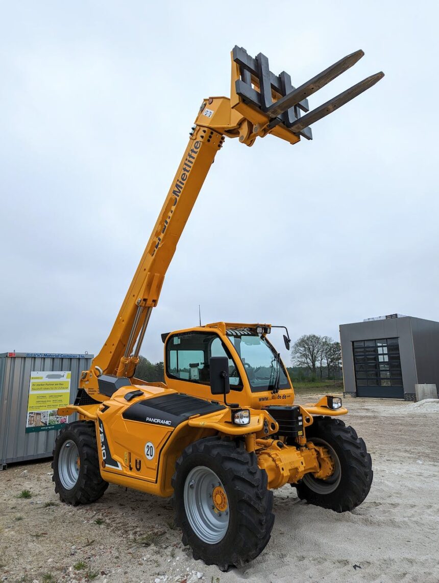 a large yellow forklift with a crane attached to it