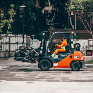 man driving truck on asphalt road